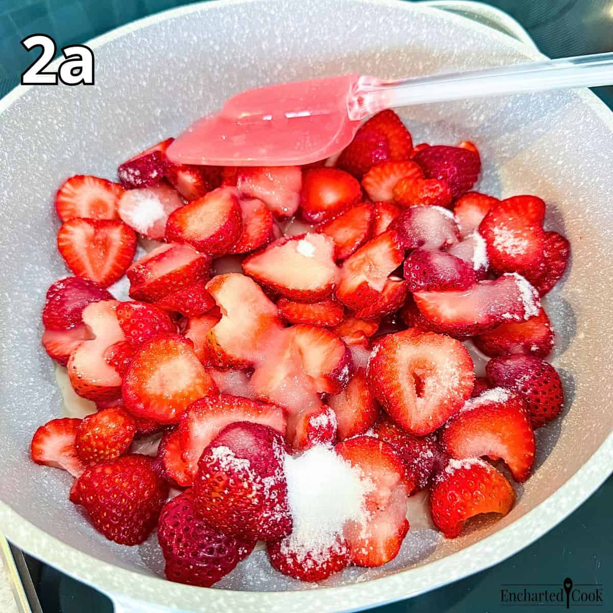 Process Photo 2a: Sliced strawberries, sugar, salt, and a flavored arrowroot slurry are ready to be cooked in a medium sized pan.