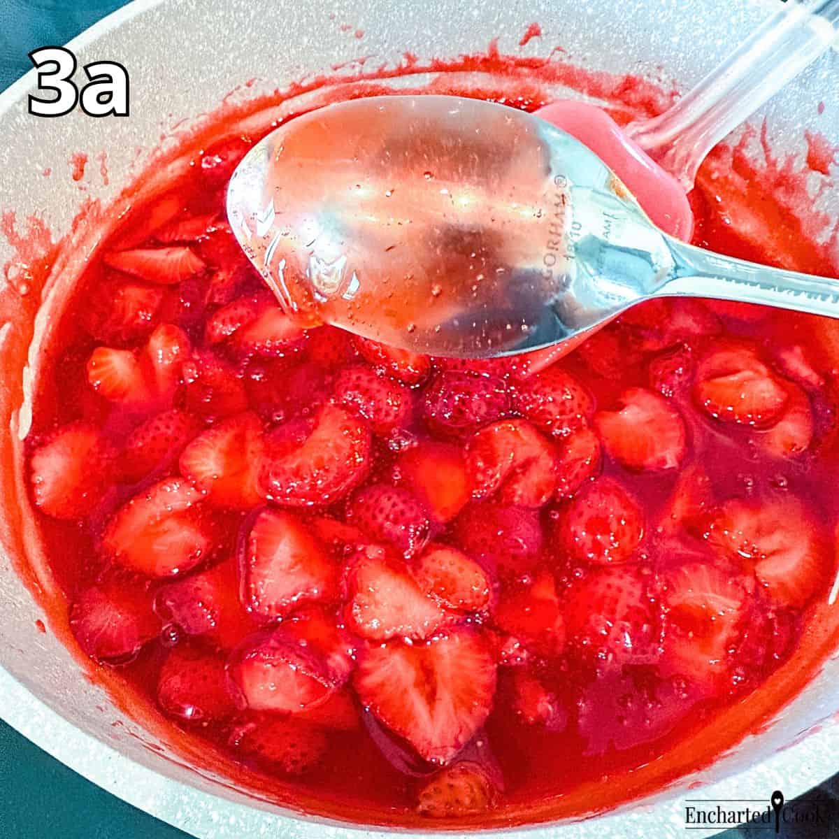Process Photo 3a: The strawberry sauce base has cooled and it coats the back of a spoon.
