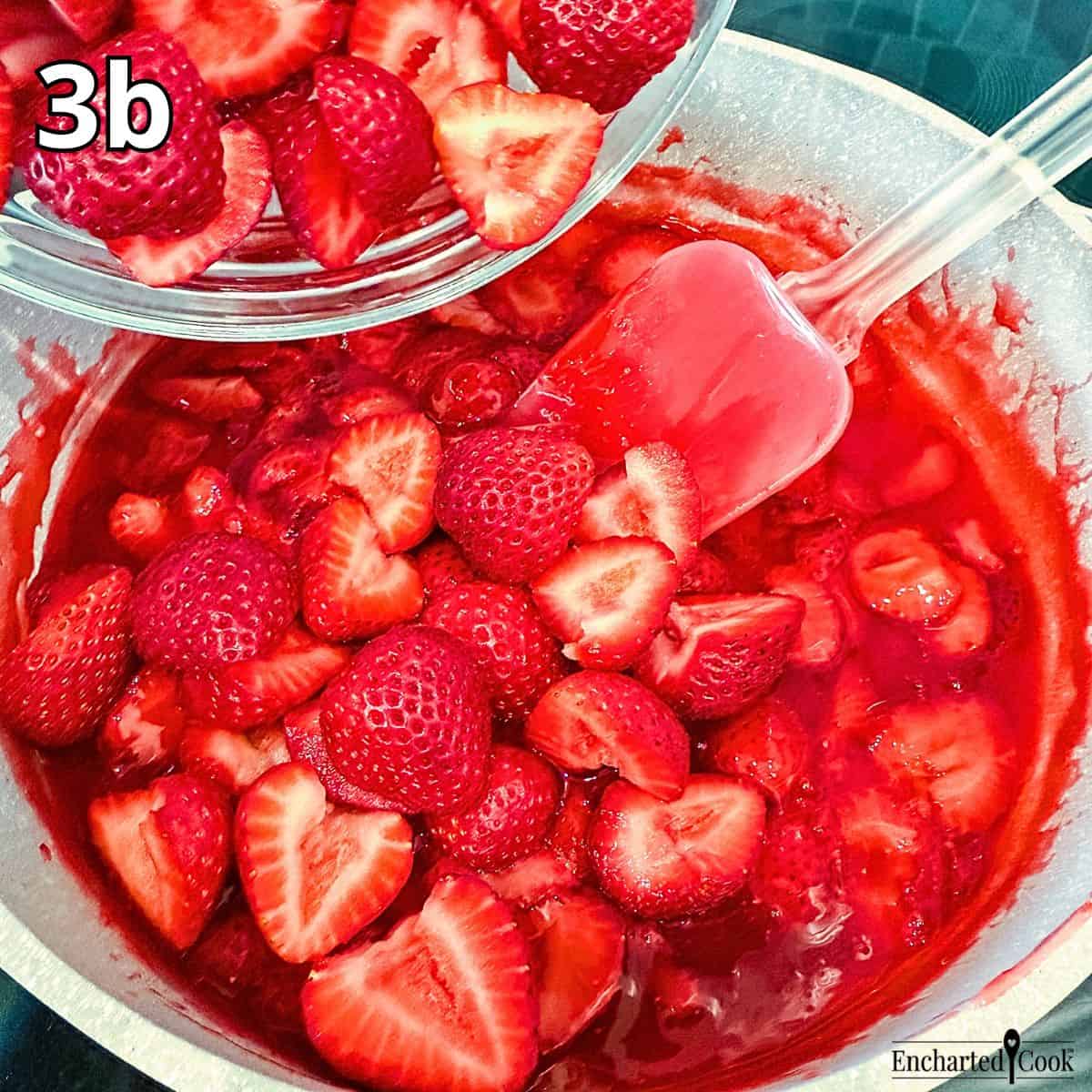Process Photo 3b - Adding fresh, halved strawberries to the strawberry sauce base.
