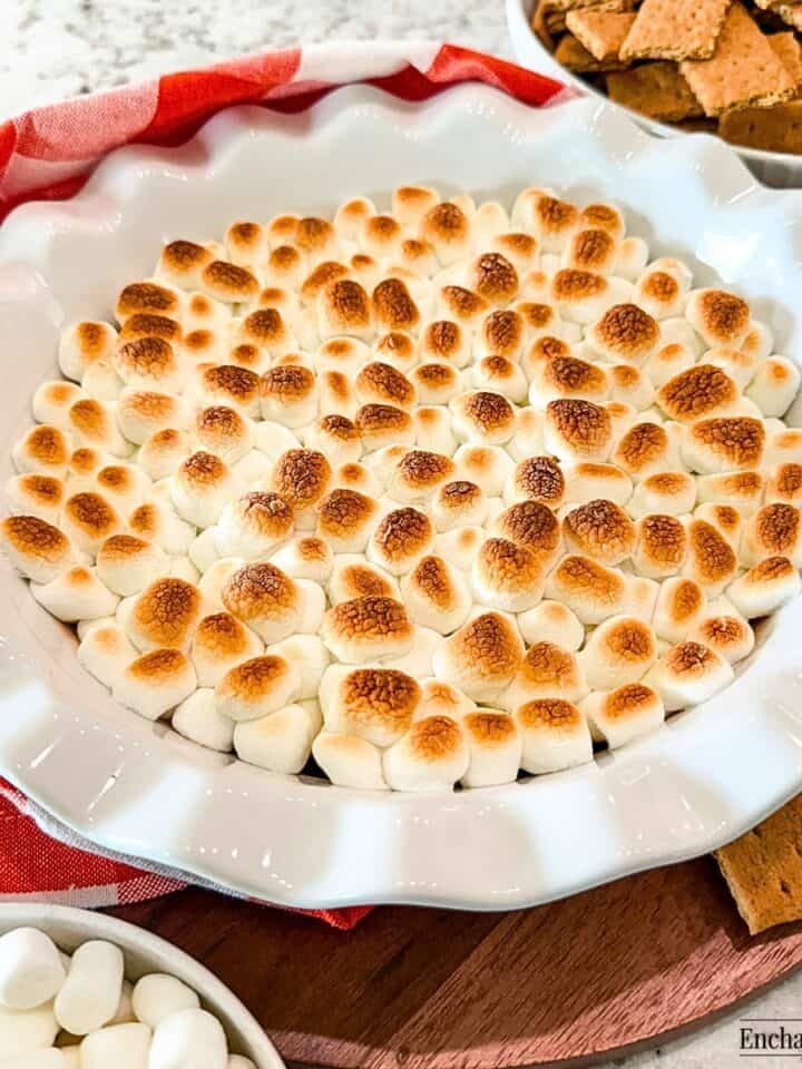 Smores Party Dip in a white ceramic pie plate.