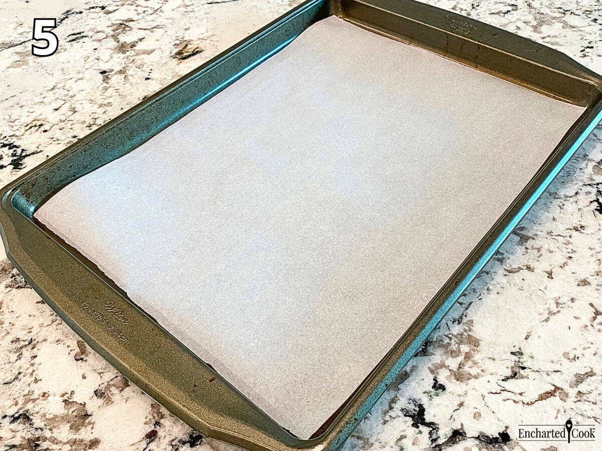 Process Photo 5 - A large rimmed baking sheet is lined with parchment paper.