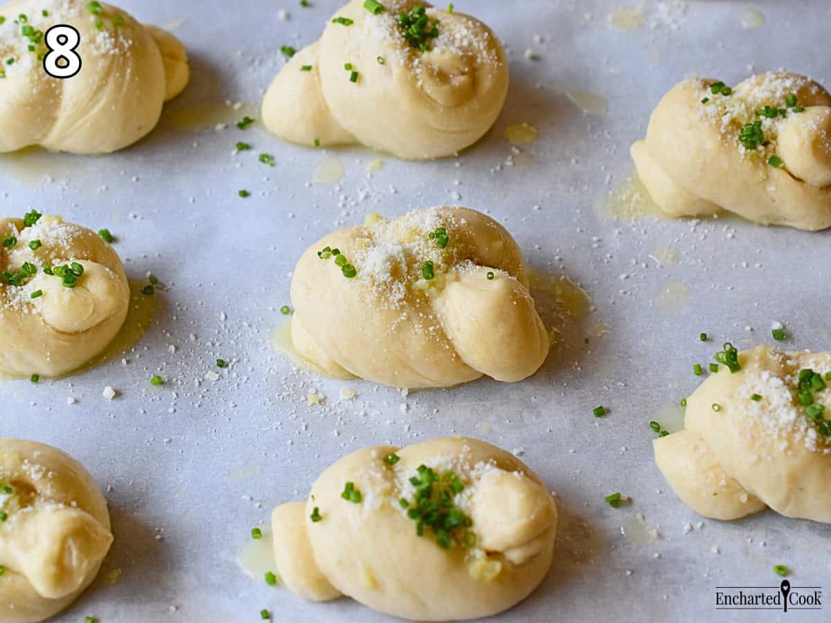 Process Photo 8 - The knots have risen and are sprinkled with Parmesan cheese and chopped fresh chives.