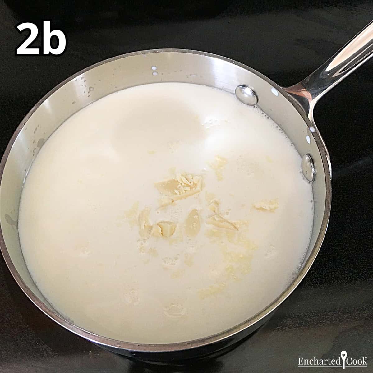 Process Photo 2b - Adding the finely chopped white chocolate to the heated milk and cream.