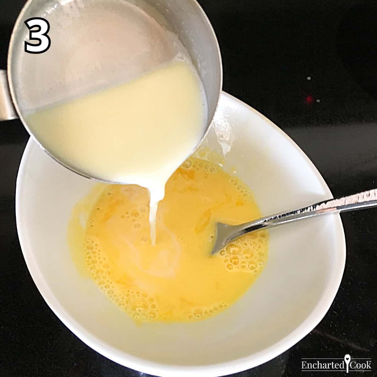 Process Photo 3 - Tempering the egg yolks with some of the hot creamy liquid.