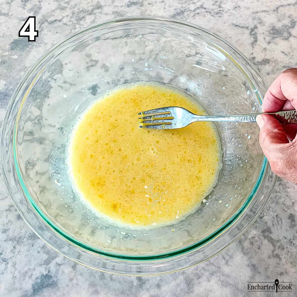 Process Photo 4 - Beating the wet ingredients with a fork in a medium-sized bowl.