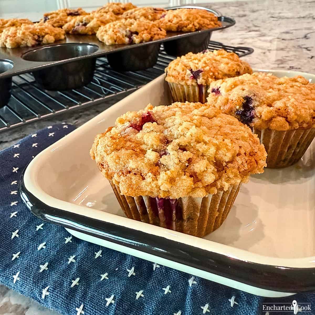 Blueberry Muffins with Streusel Crump Topping in a white pan.