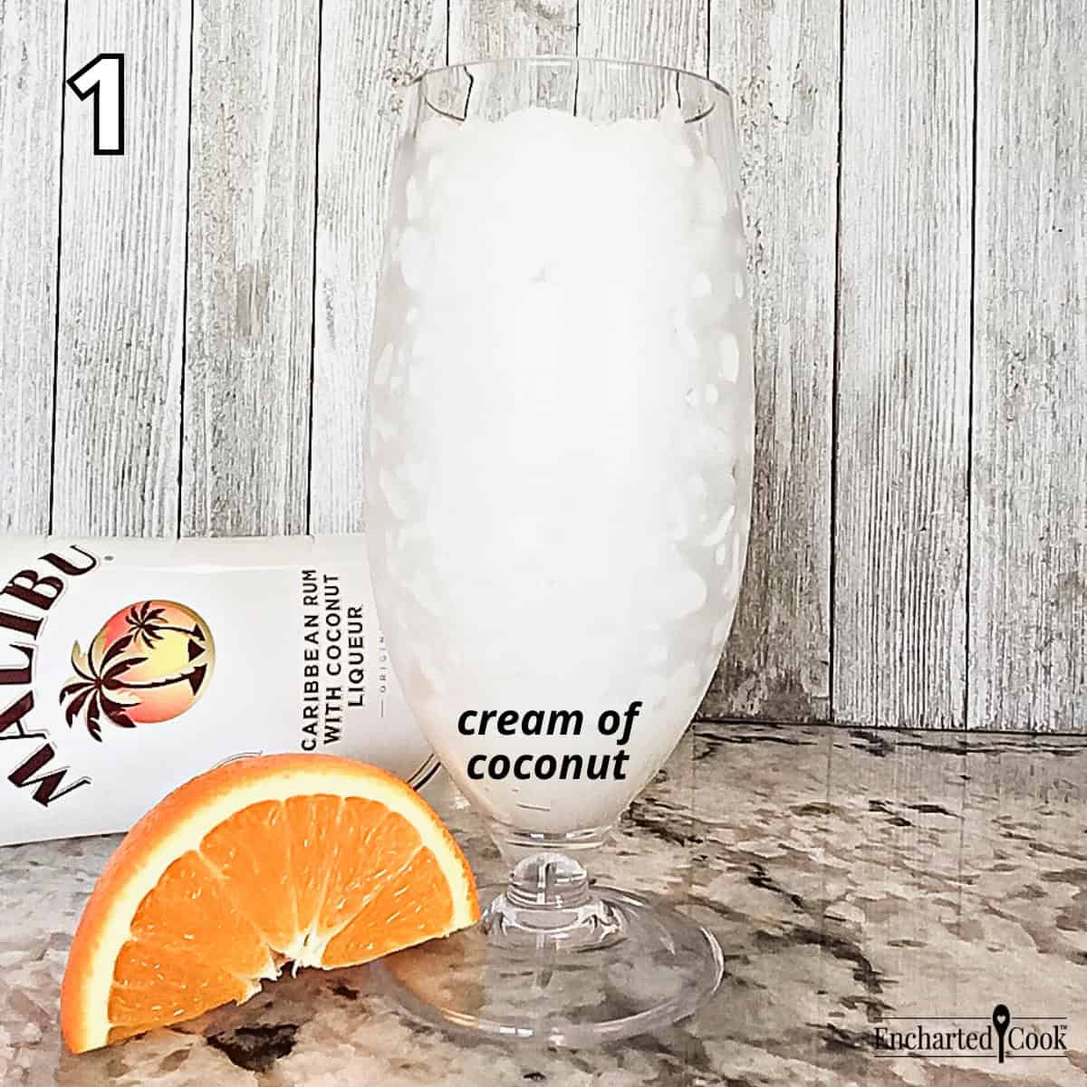 Process Photo 1 - Cream of coconut is added to the bottom of the glass and crushed ice is added on top.