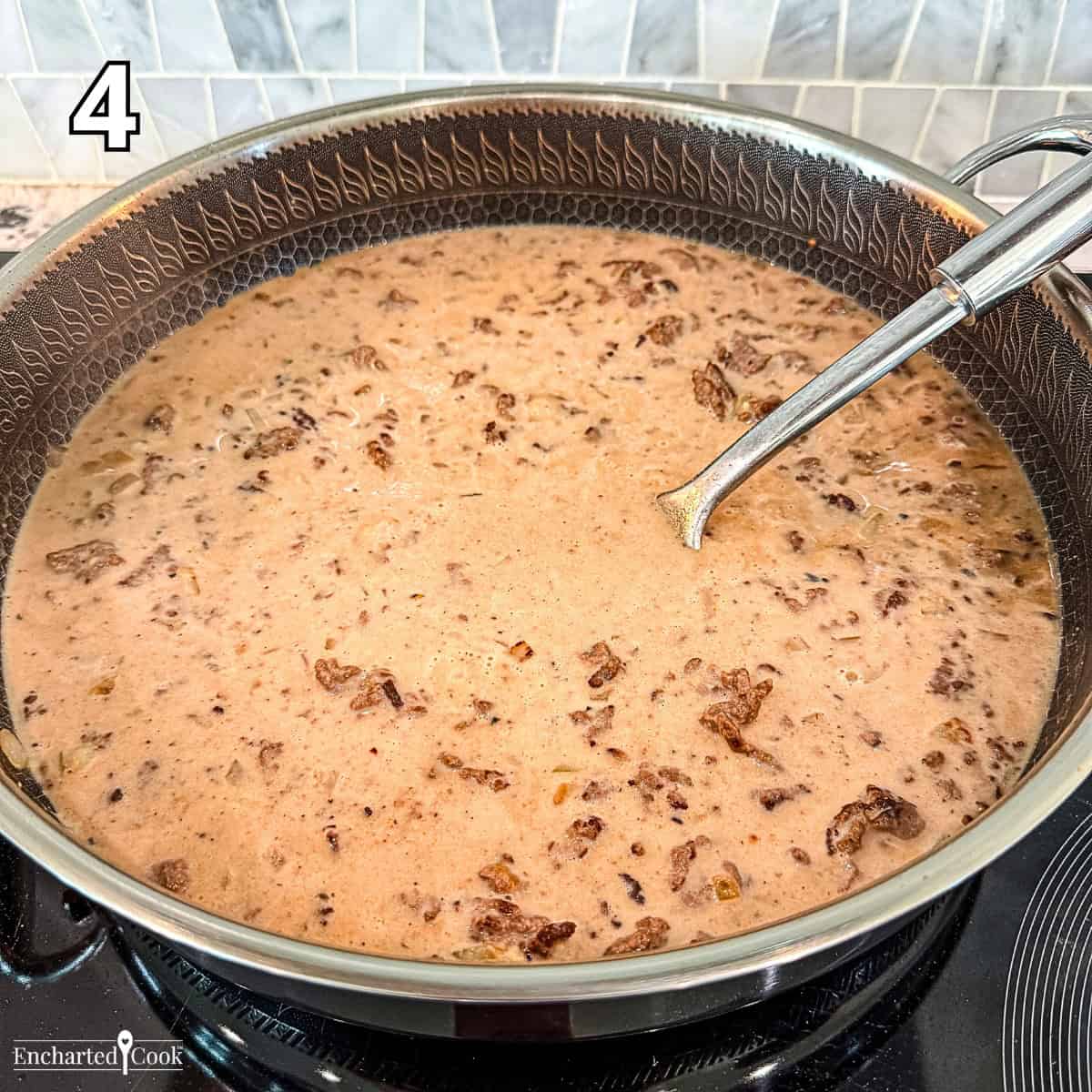 Process Photo 4 - Adding beef broth, heavy cream, tomato paste, black pepper, and Worcestershire sauce to the cooked beef mixture.