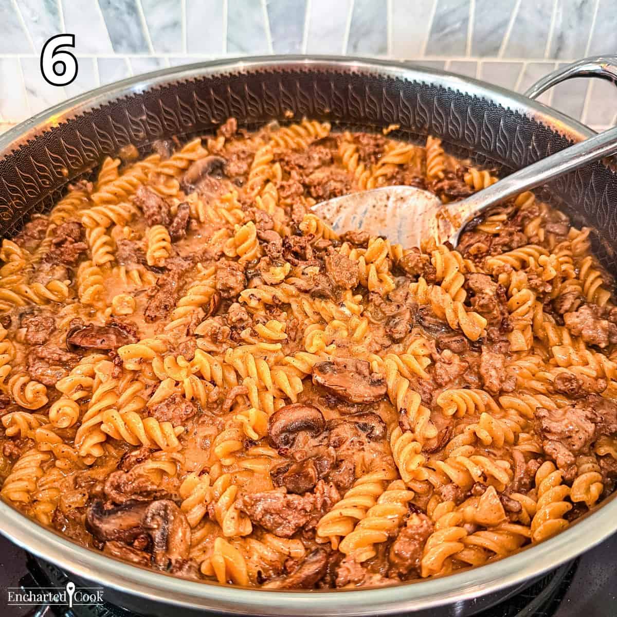 Process Photo 6 - Stirring sour cream into the ground beef stroganoff.