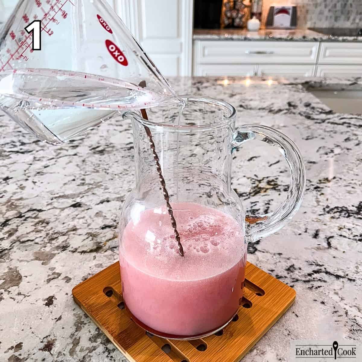 Process Photo 1 - Adding lemon-lime soda to a pitcher of cranberry juice combined with pina colada mixer.