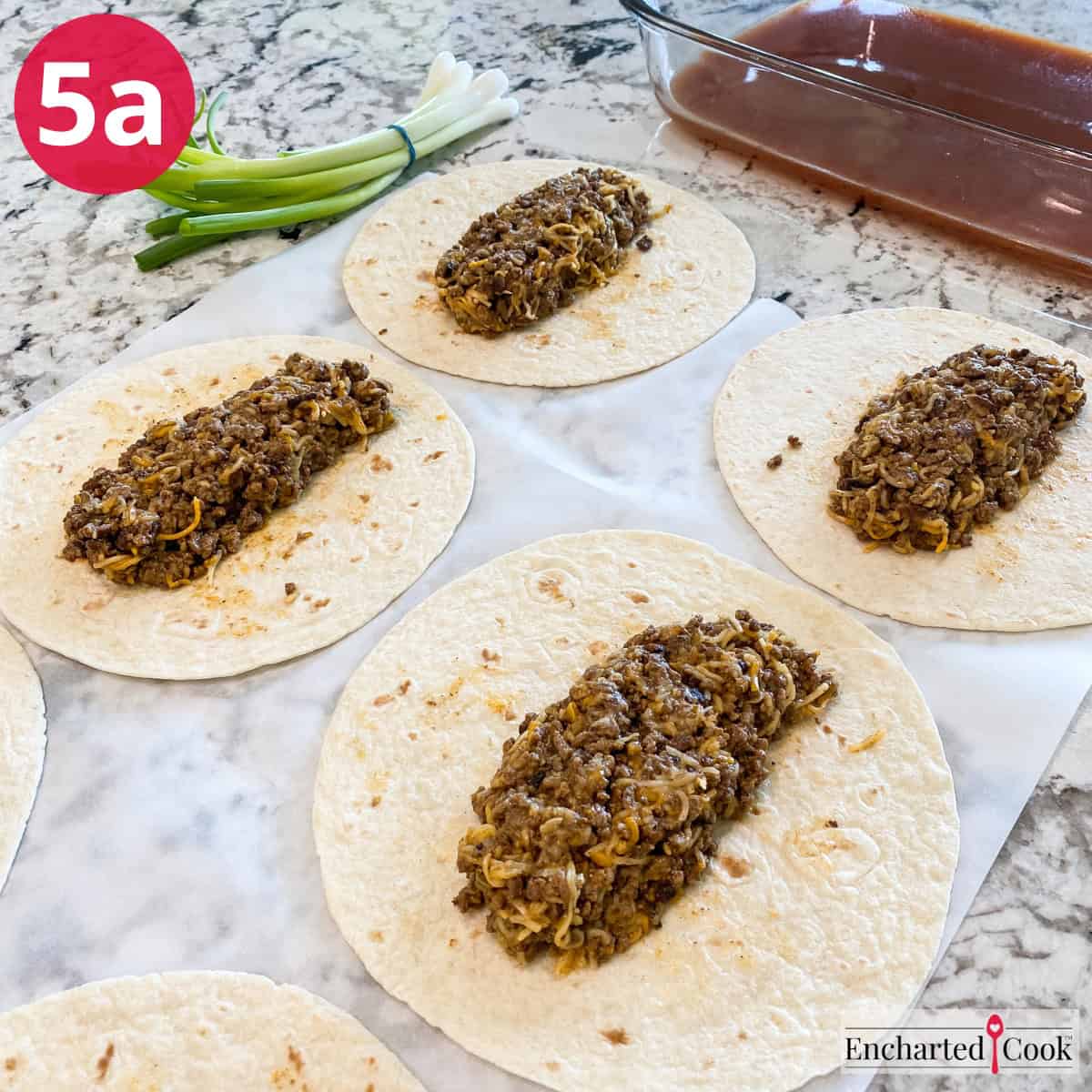 Process Photo 5a - Filling flour tortillas with the ground beef and cheese enchilada filling.
