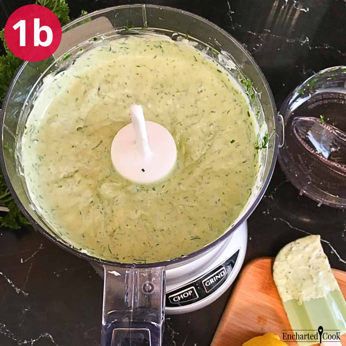 Process Photo 1b - The green goddess salad dressing is completely mixed in the bowl of a small food processor.
