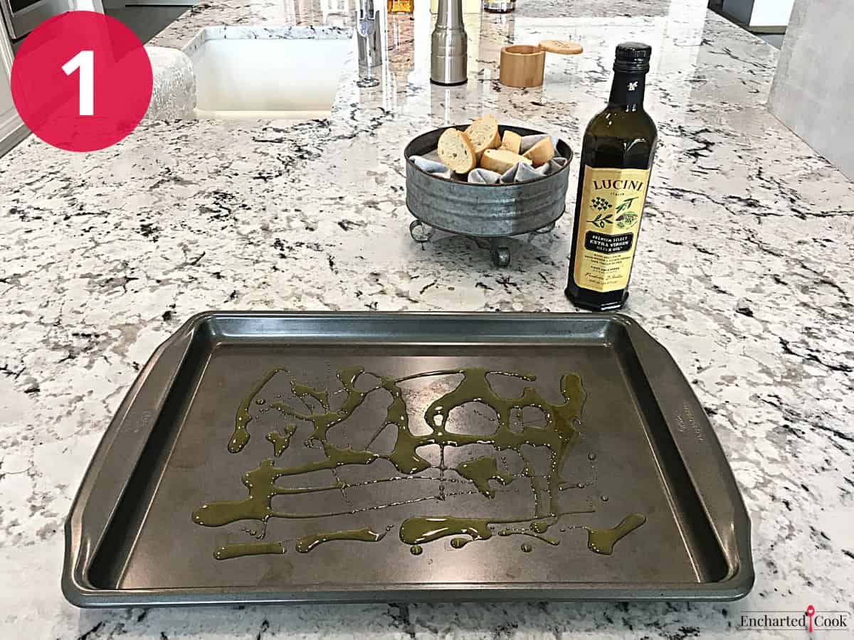 Process Photo 1 - Drizzling a large baking sheet with olive oil.
