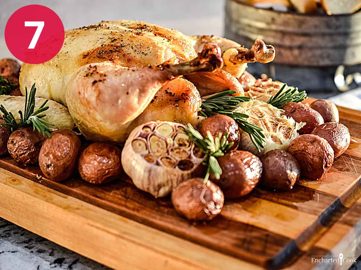 Process Photo 7 - The Roasted Chicken with Potatoes and Garlic on a cutting board, and ready to serve.