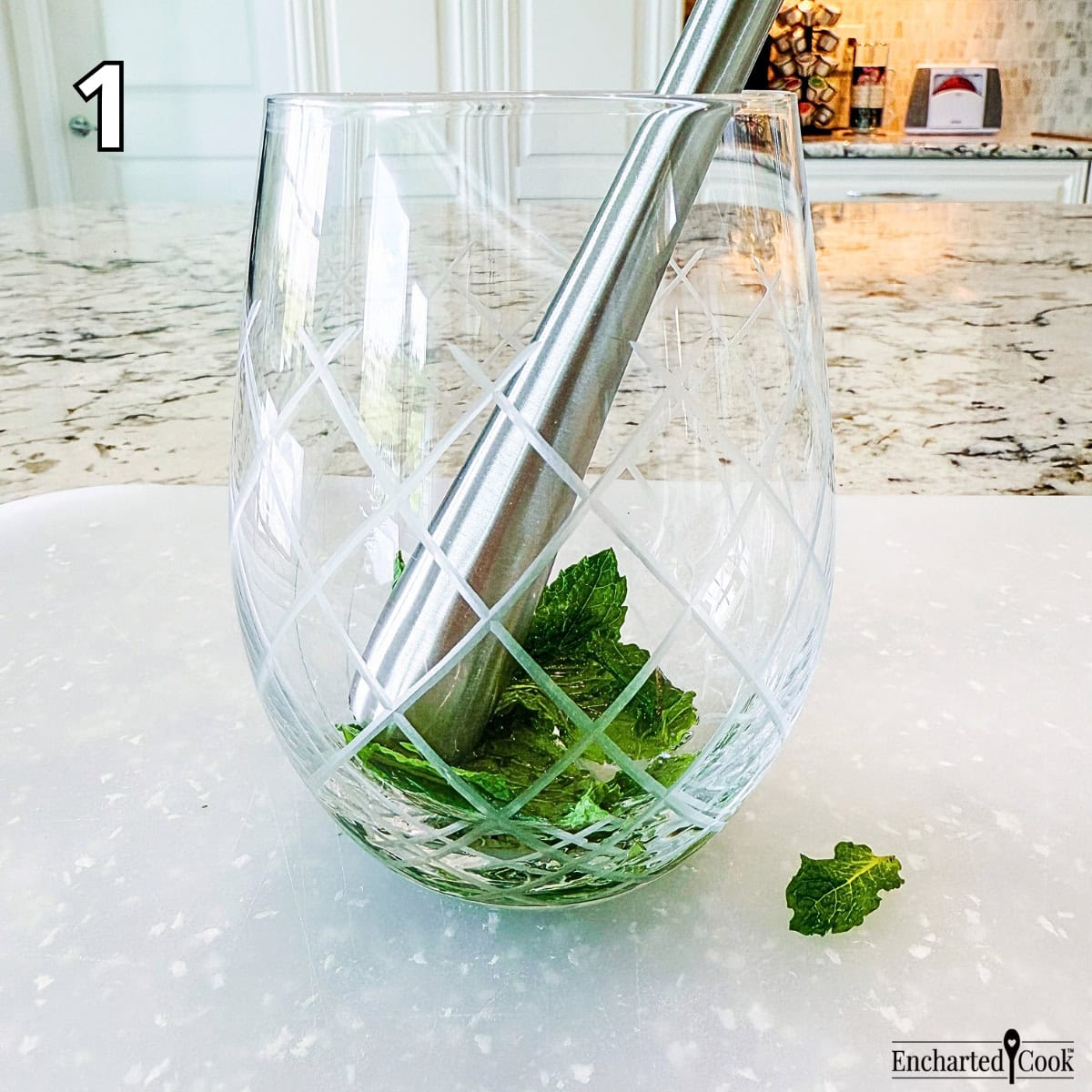 Process Photo 1 - Muddling mint leaves with mint simple syrup in a glass or cup.