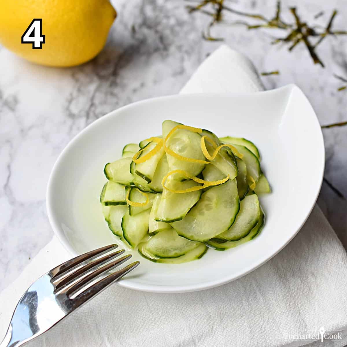 Process Photo 4 - Serving the pickled cucumber with a lemon zest garnish.