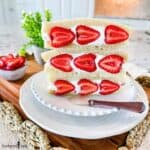 Three Strawberry Sando on a white plate with a spreader knife for decor.