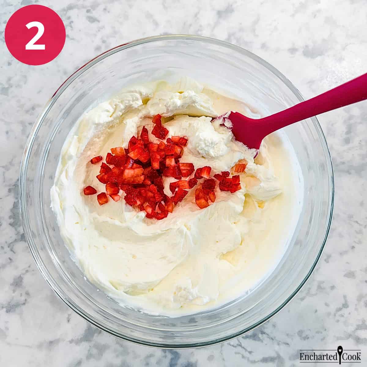 Process Photo 2 - Make the whipped cream filling and fold in chopped strawberries.