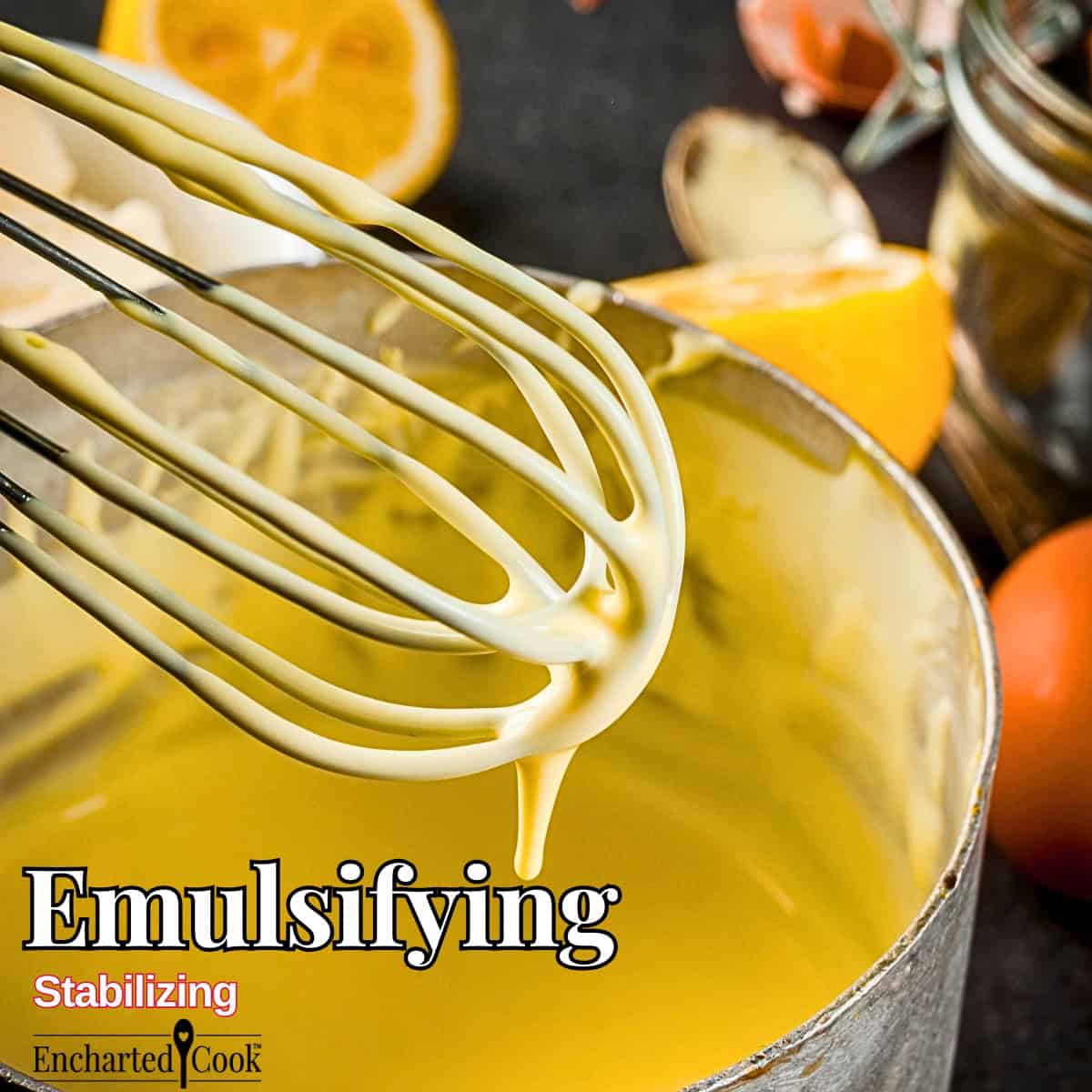Emulsifying: An image of a completely emulsified hollandaise sauce dripping from a wire whisk into a bowl, surrounded by eggs, butter, and halved lemons. with text overlays.