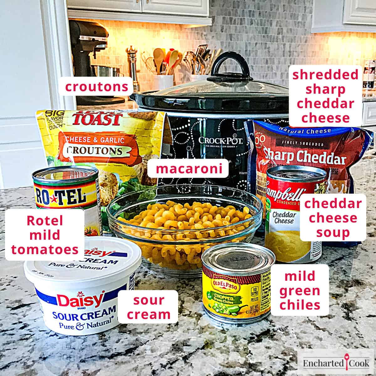 The ingredients, clockwise from top right: shredded sharp cheddar cheese, cheddar cheese soup, mild green chiles, macaroni, sour cream, Rotel mild tomatoes, and croutons.
