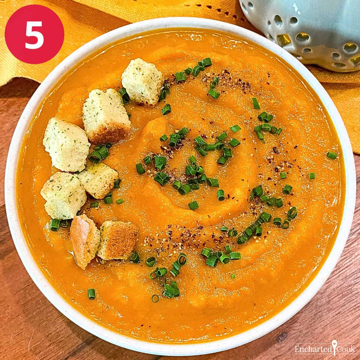 Process Photo 5 - A bowl of Pumpkin Soup with Brandy garnished with croutons, chives, and black pepper ready to be enjoyed.